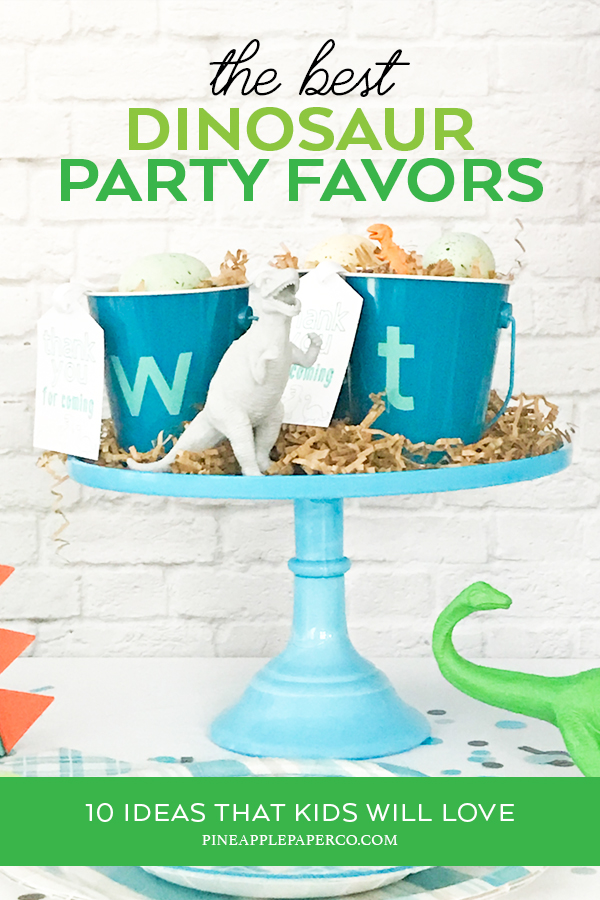Dinosaur Favors on a Blue Cake Stand - Dinosaur Favor Ideas curated by Pineapple Paper Co.