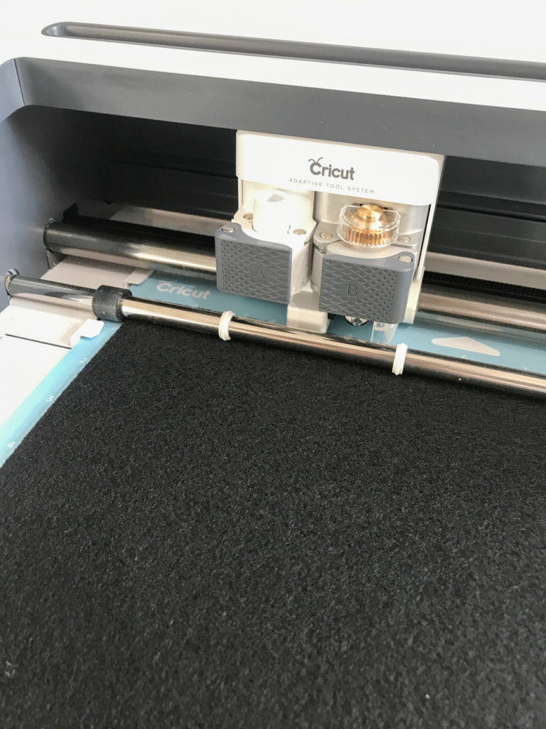 Cricut Maker cutting Black Felt for DIY Black Cat Mask by Pineapple Paper Co.