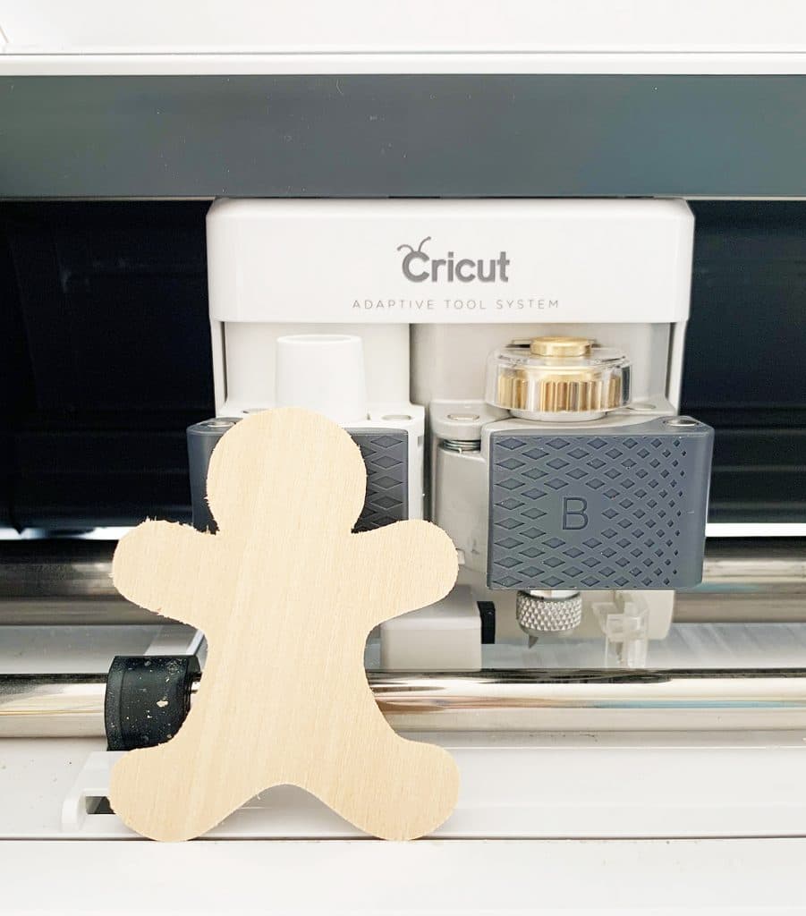 DIY Gingerbread Ornaments cut out of wood with the Cricut Maker by Pineapple Paper Co.