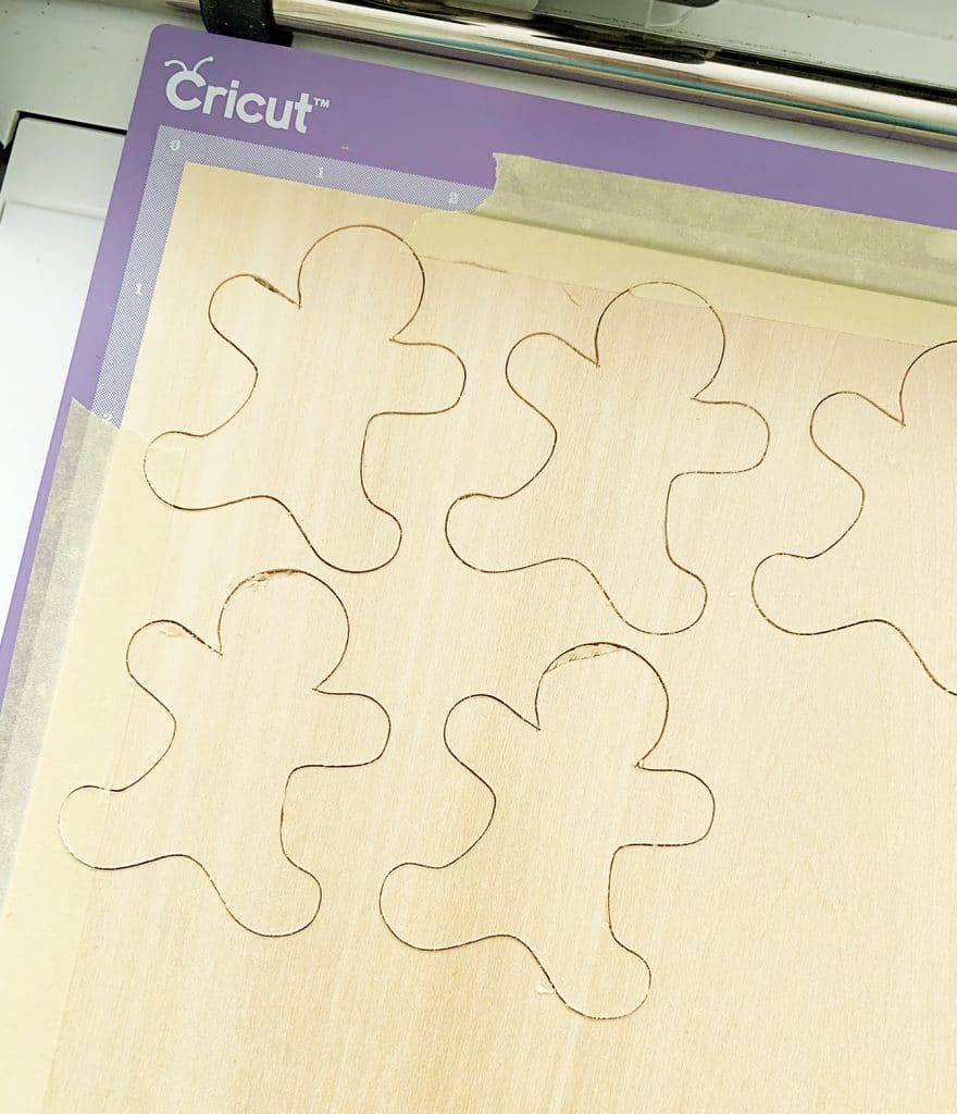 DIY Gingerbread Ornaments cut out of wood with the Cricut Maker by Pineapple Paper Co.