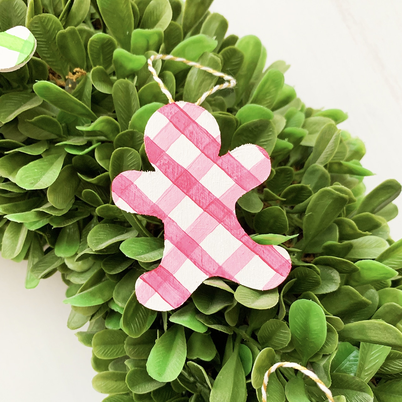 DIY Gingerbread Ornaments cut out of wood with the Cricut Maker by Pineapple Paper Co.