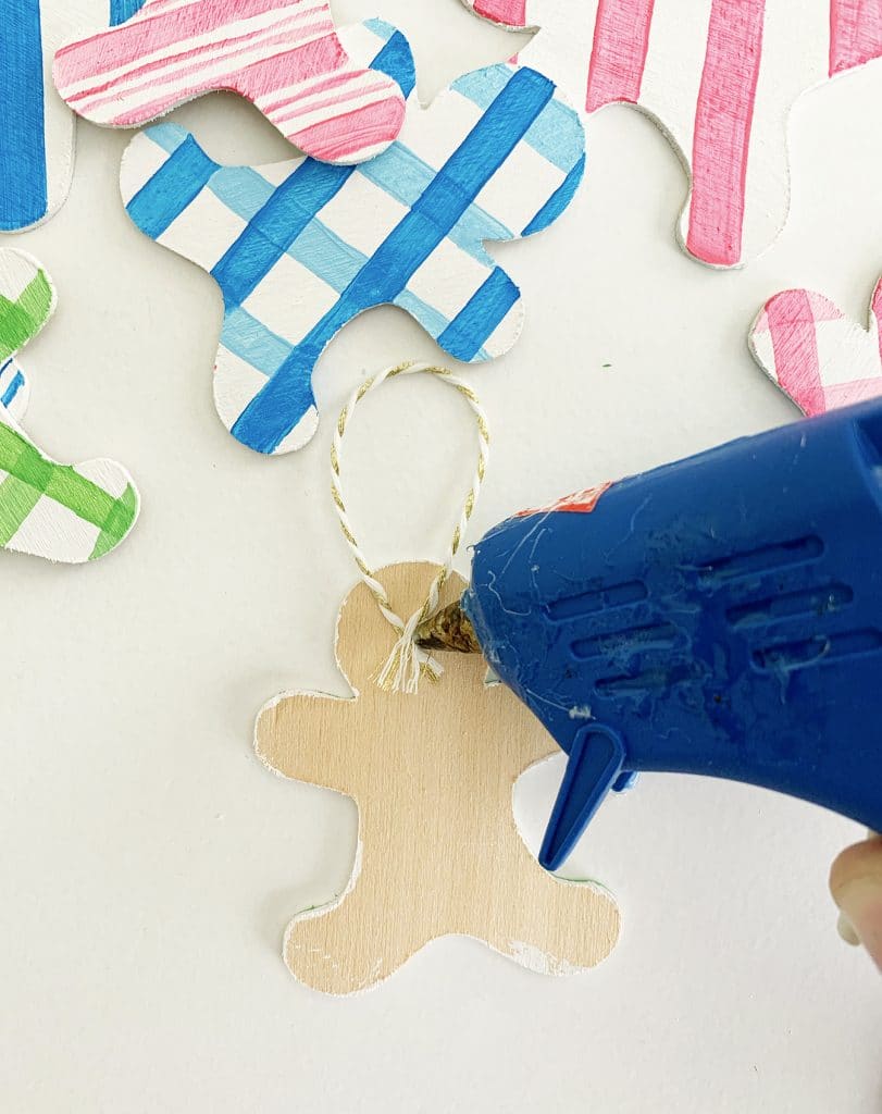 DIY Gingerbread Ornaments cut out of wood with the Cricut Maker by Pineapple Paper Co.