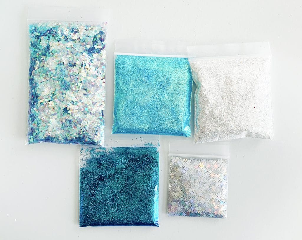 Frozen Inspired Glitter Slime Recipe for Frozen Birthday Parties and Favors by Pineapple Paper Co.