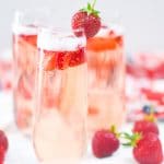 Strawberry Bellini with Fresh Sliced Strawberries and Whole Strawberry Garnish