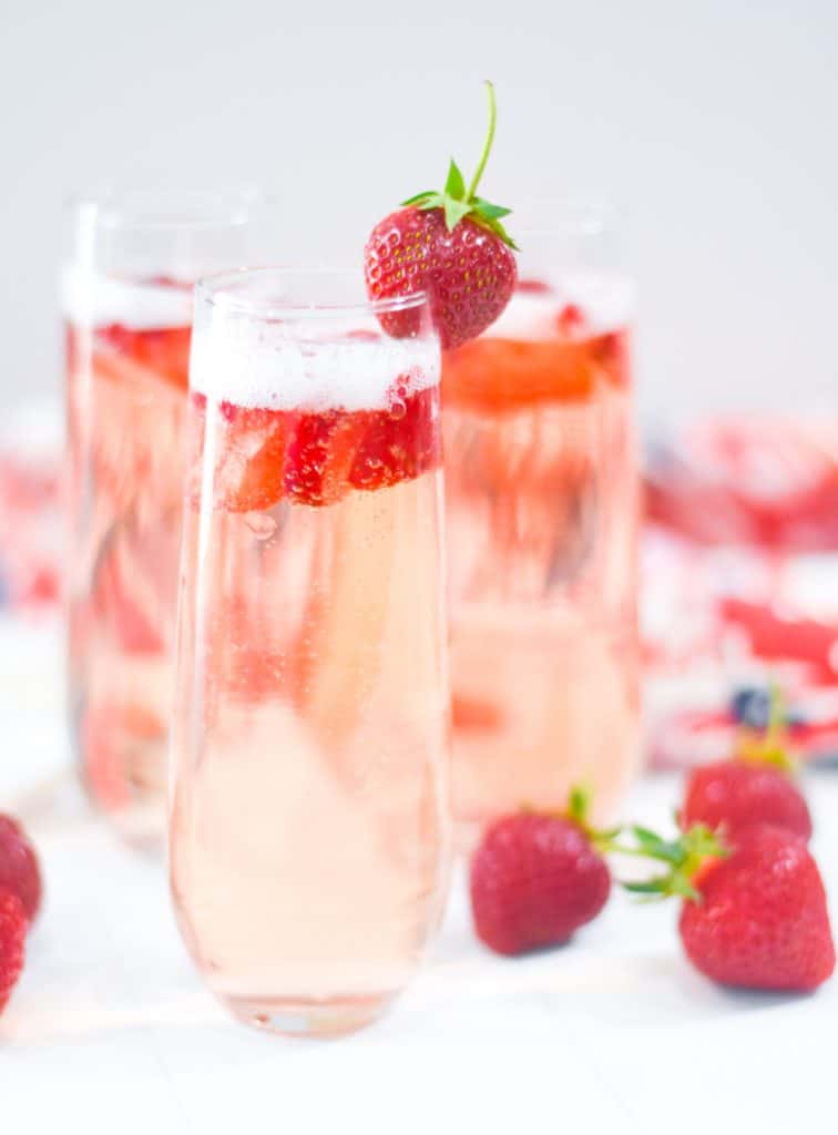 Strawberry Bellini with Fresh Sliced Strawberries and Whole Strawberry Garnish