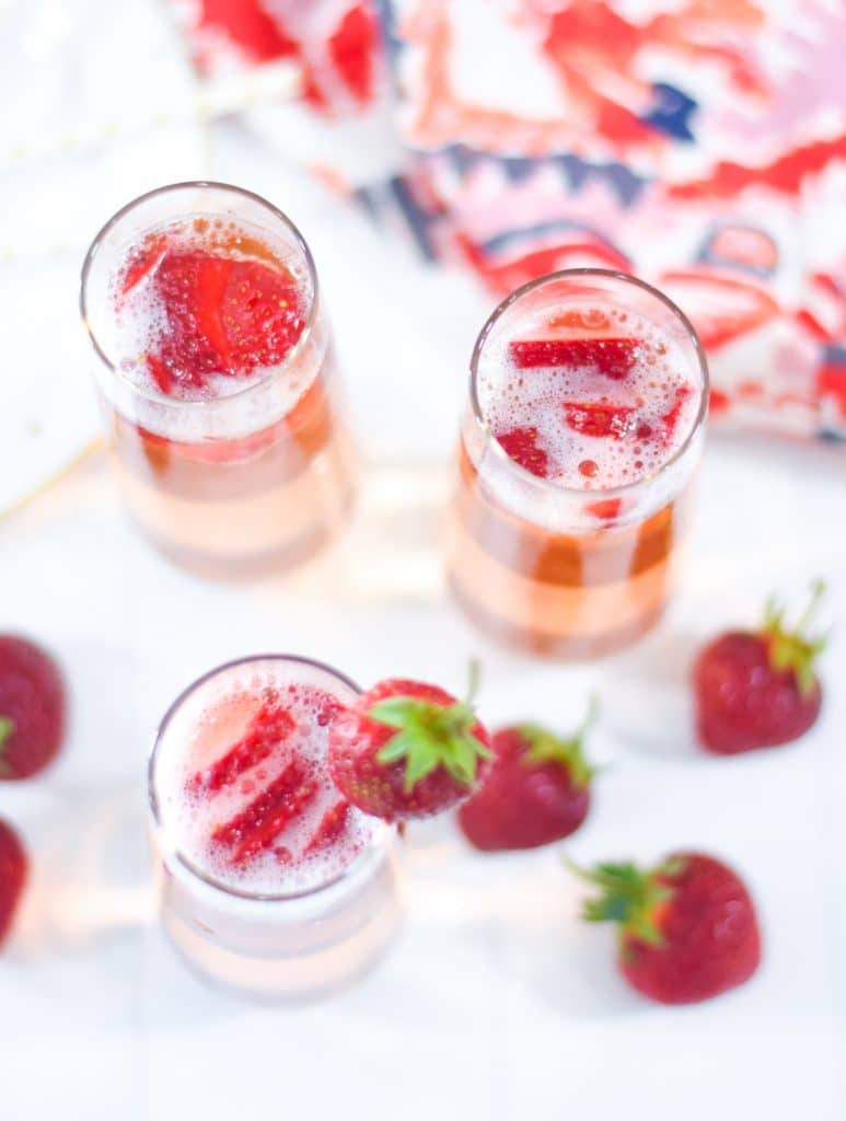 Strawberry Bellini with Fresh Sliced Strawberries and Whole Strawberry Garnish