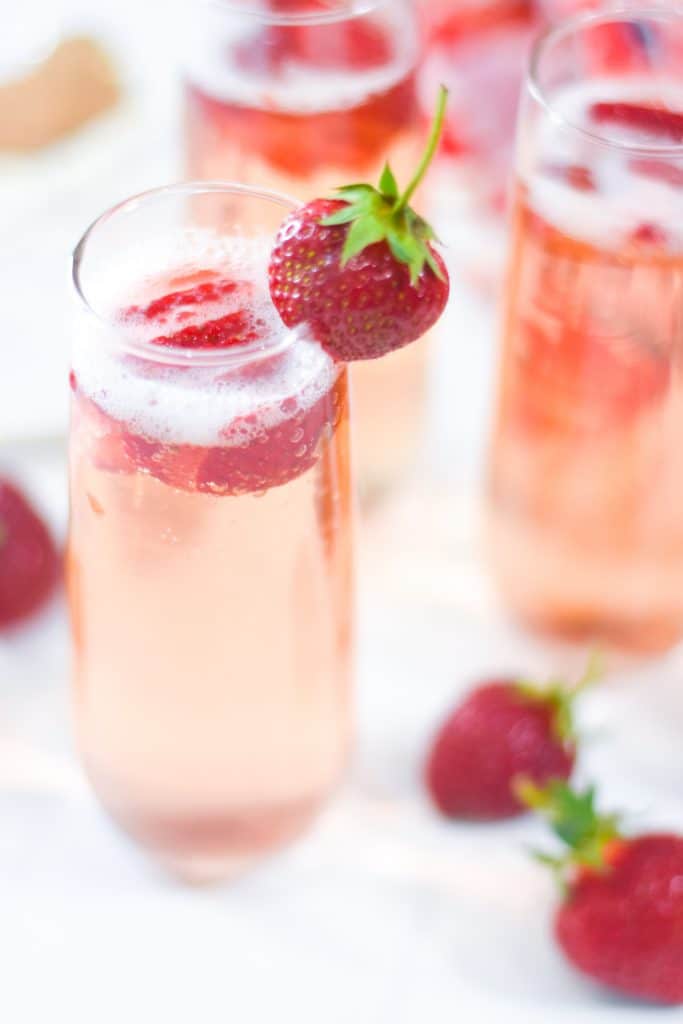 Strawberry Bellini with Fresh Sliced Strawberries and Whole Strawberry Garnish