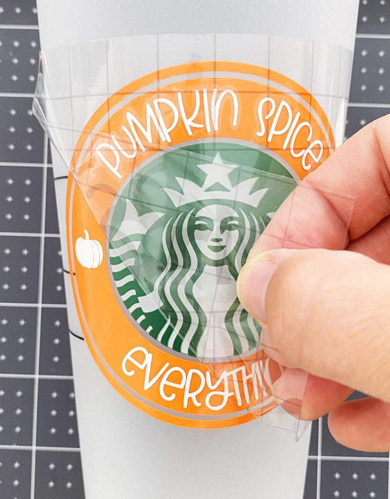Applying Pumpkin Spice Vinyl Decal to Starbucks Cold Cup