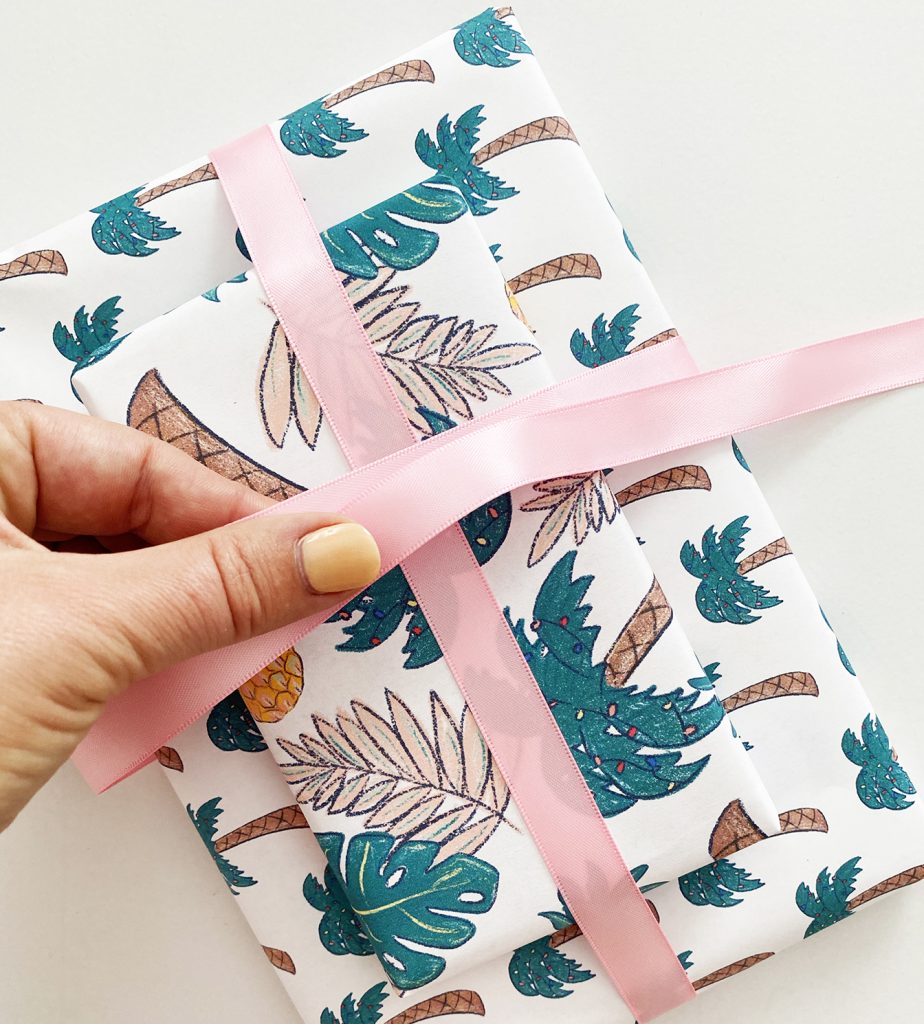 Tying Ribbon on Printable Wrapping Paper from Pineapple Paper Co.