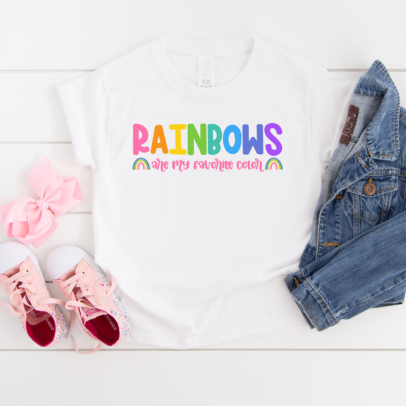 Rainbows Are My Favorite Color Free SVG on a White Shirt with Pink Shoes and Jean Jacket