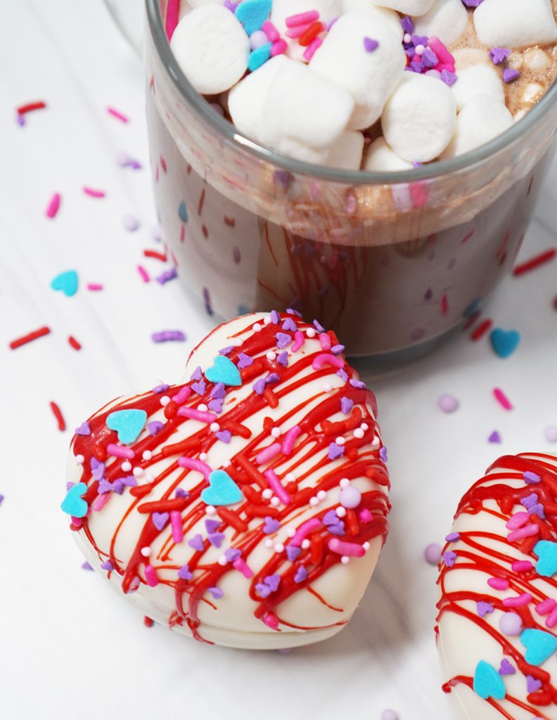 Heart Shaped Valentine Hot Cocoa Bomb with Glass Mug of Hot Chocolate