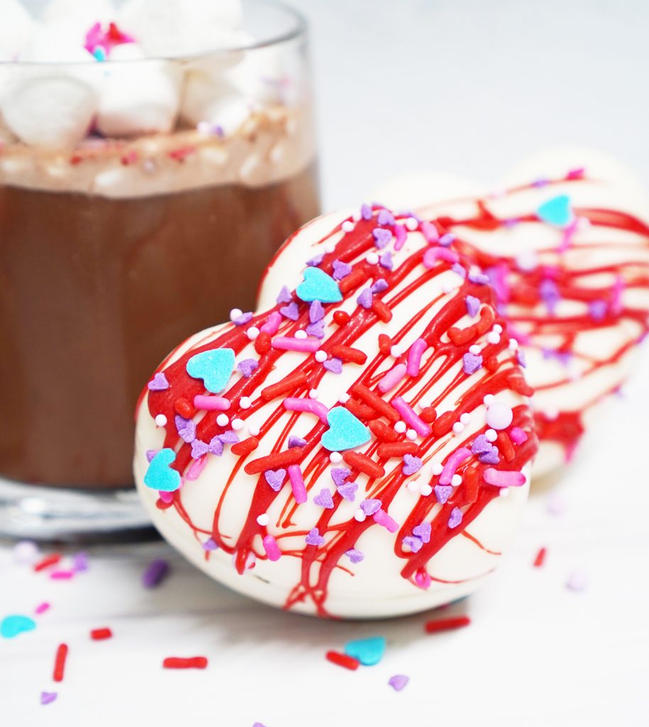 Heart Shaped Valentine Hot Cocoa Bomb with Glass Mug of Hot Chocolate
