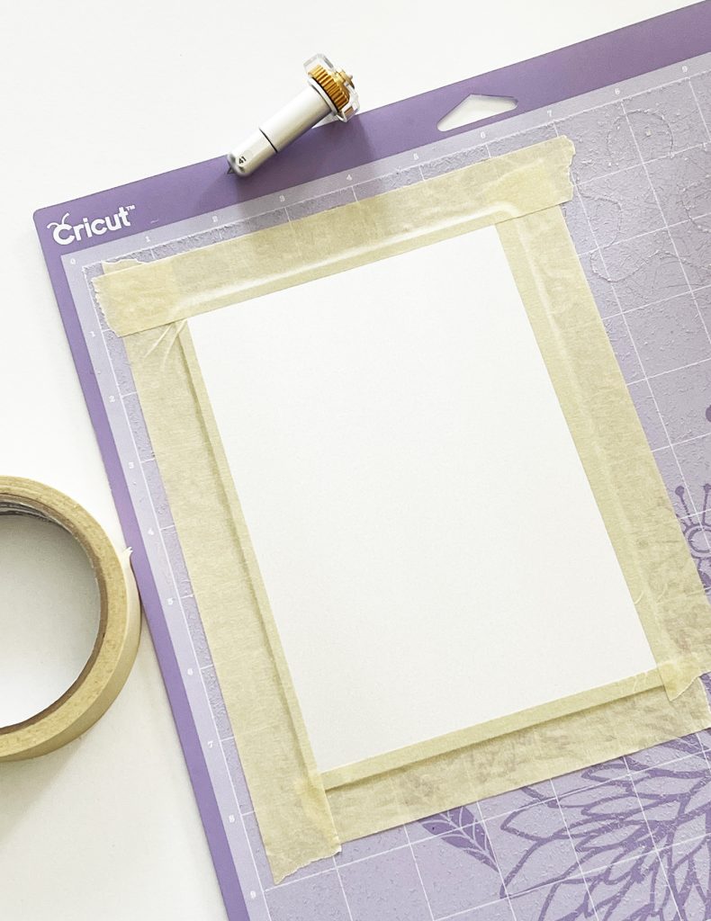 Cricut Engraving Aluminum Sheet taped onto Cricut StrongGrip Mat with Masking Tape