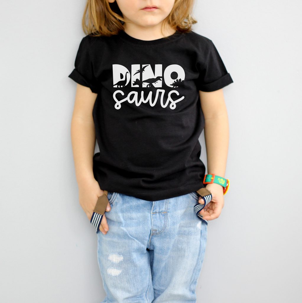 Free Dinosaurs SVG in White HTV on Black Shirt