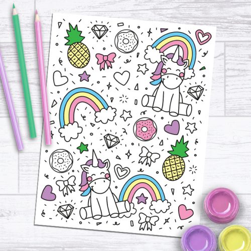 Unicorn Coloring Page Free Printable on Paper Background with Colored Pencils and Paint