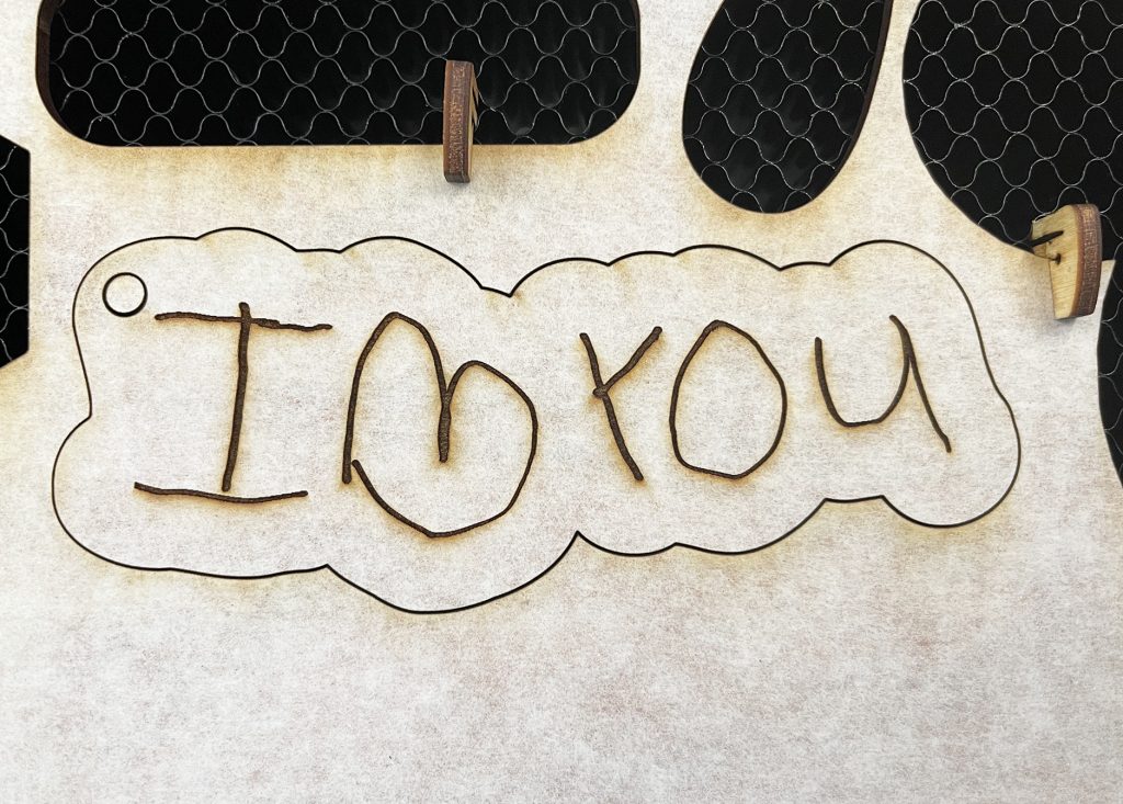 DIY Laser Cut Wood Keychain with I Love You in Toddler Handwriting Made with Glowforge