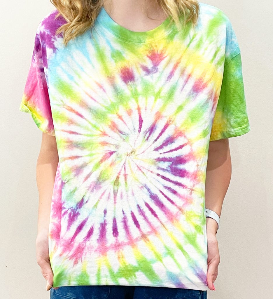 Girl in Rainbow Spiral Tie Dye Shirt