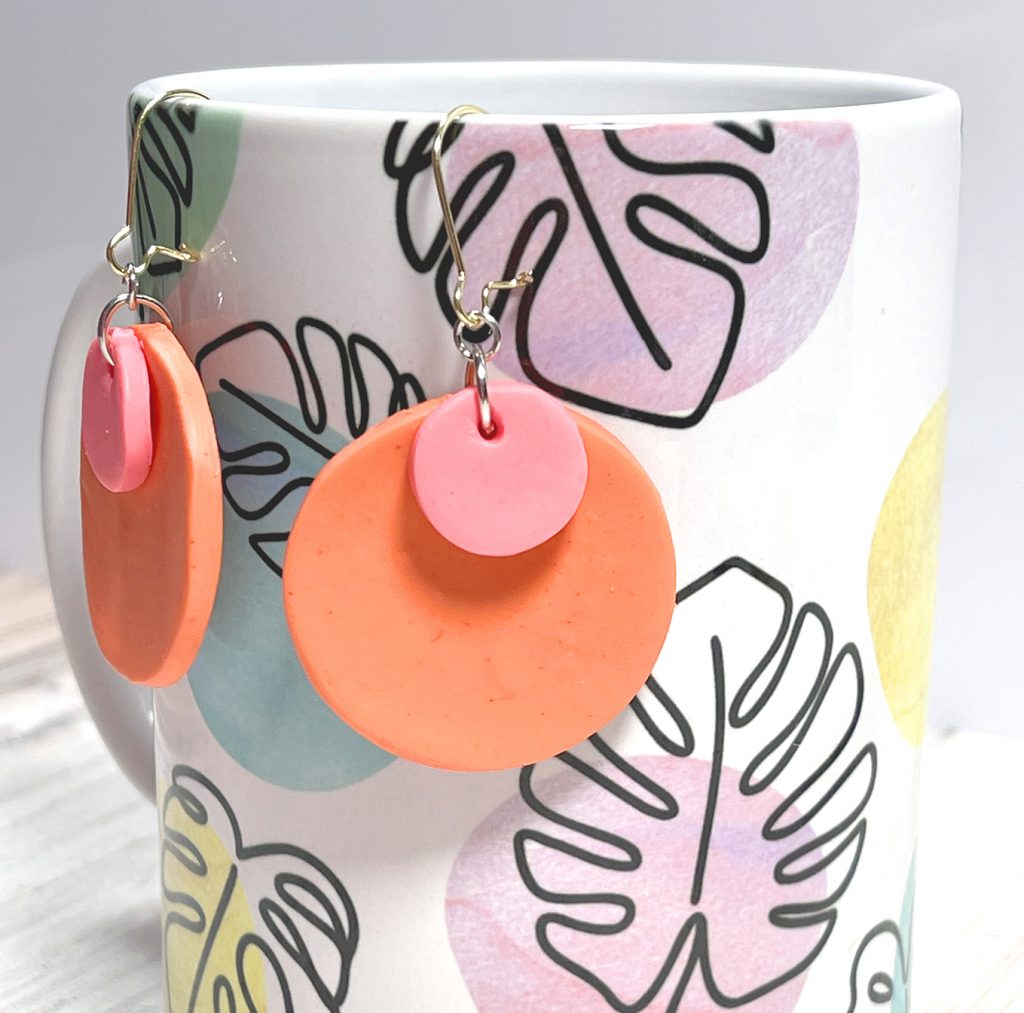 simple circle orange and pink clay earrings on hooks