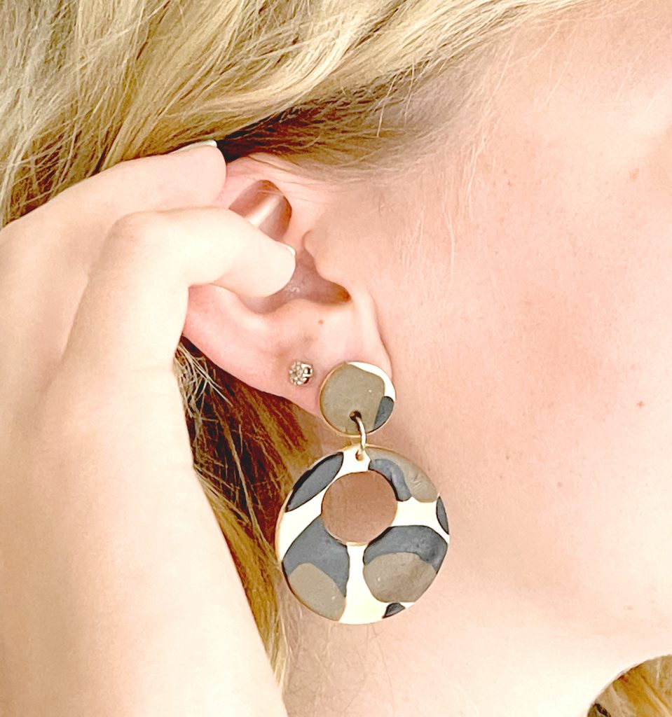 leopard print polymer clay earrings in ear