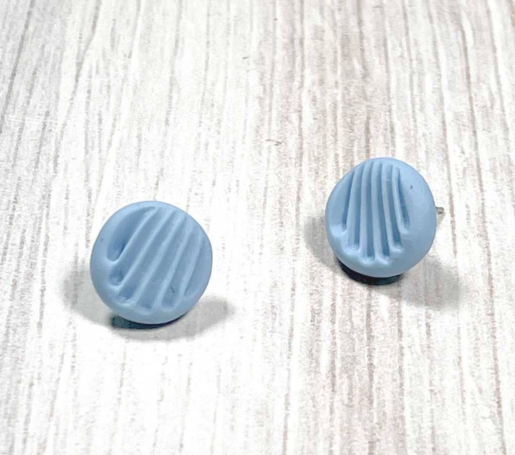 small blue polymer clay earrings with shell texture