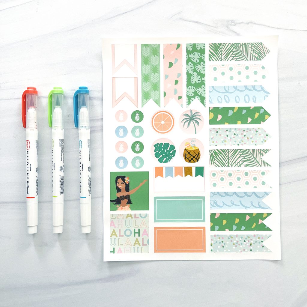 Printable Planner Stickers for summer with 3 mildliners on white marble countertop