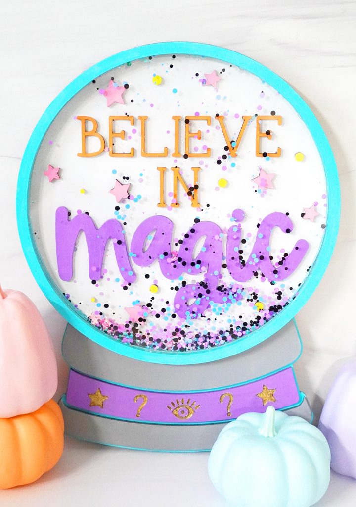 DIY Crystal Ball Sign Made with the Glowforge and free SVG file with pumpkins in the foreground