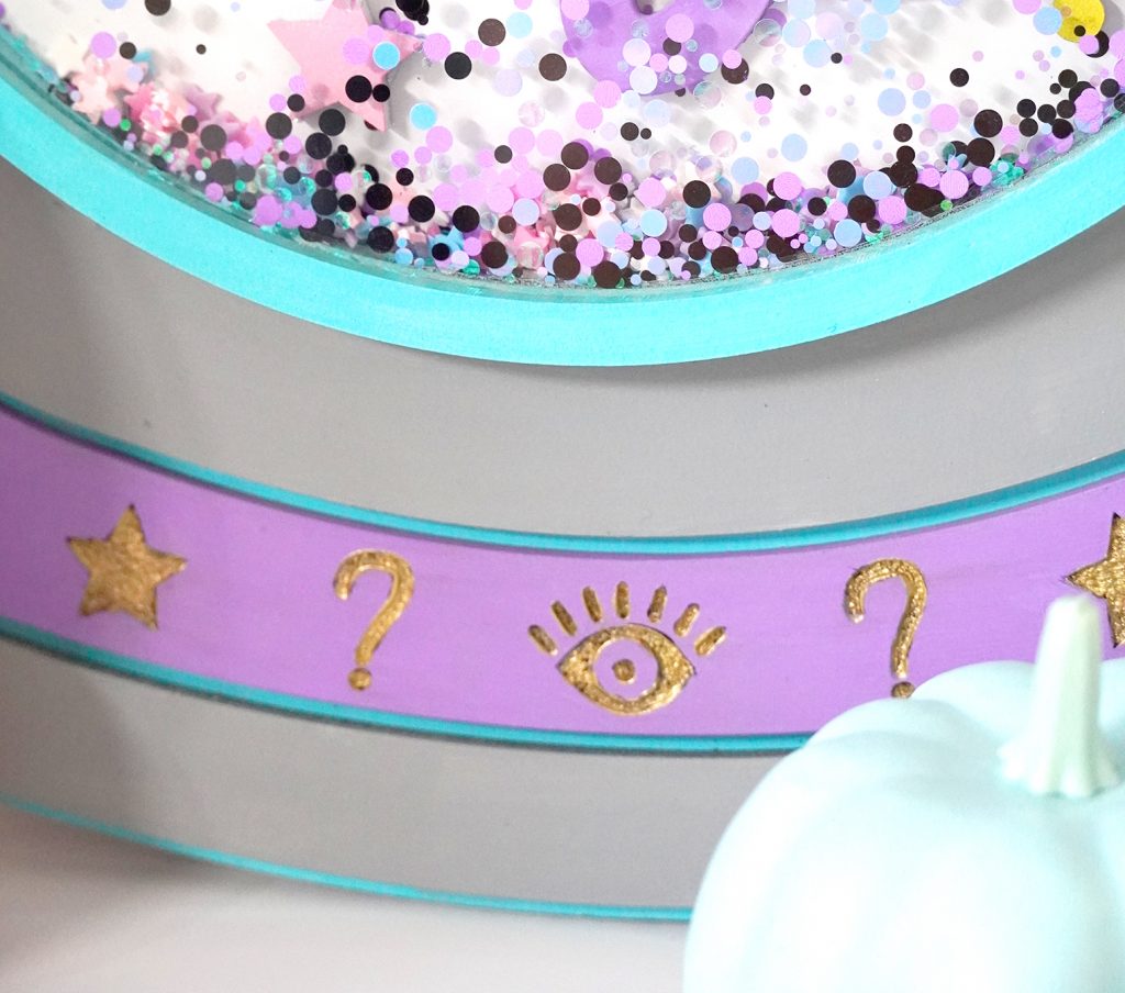 Close up of gold details on DIY Crystal Ball Sign Made with the Glowforge and free SVG file