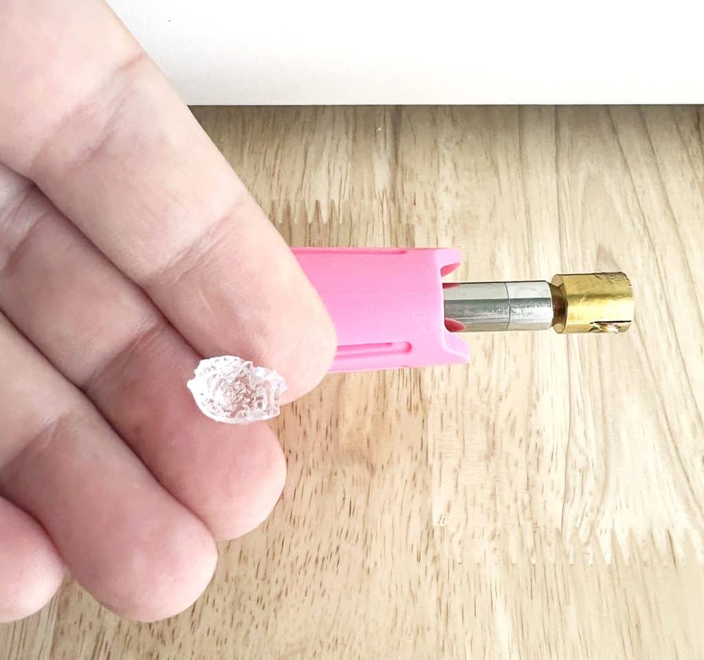 acrylic removed from snow globe tumbler with hot fix tool