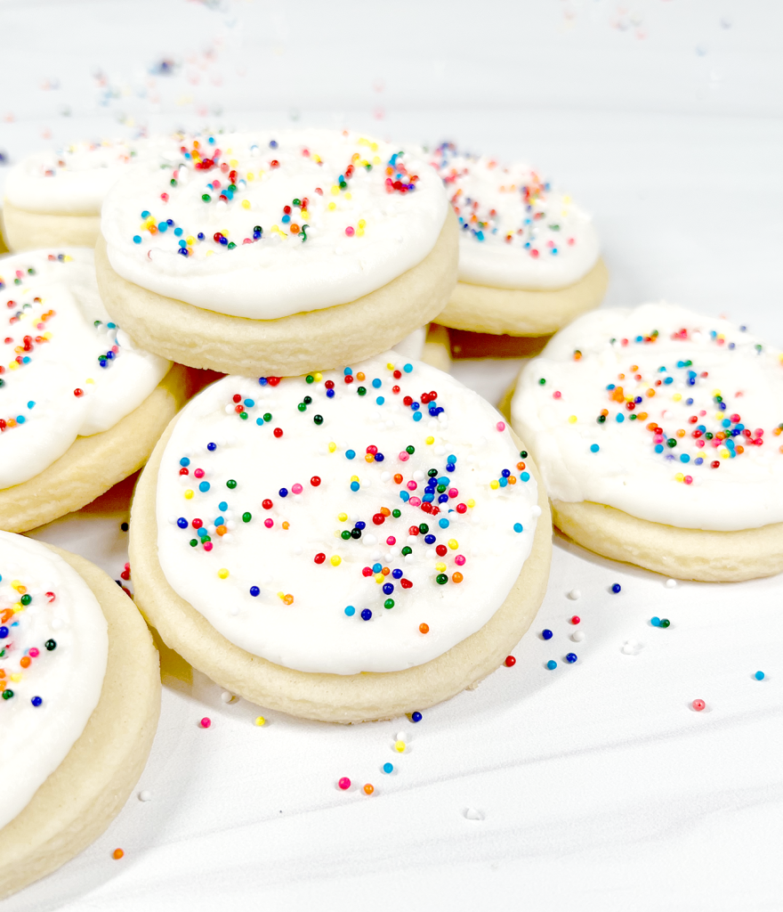 cut out sugar cookies with rainbow sprinkles close up