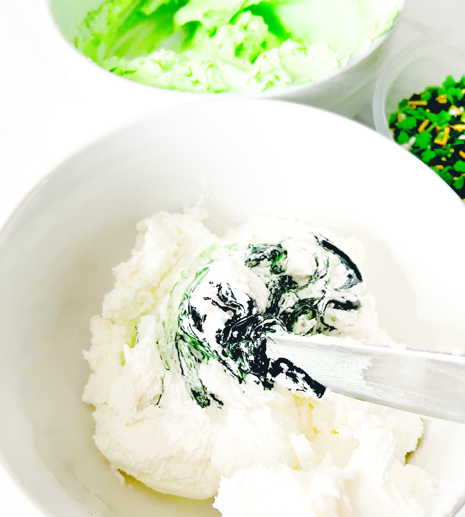 coloring cookie frosting with green food coloring to make pale green icing