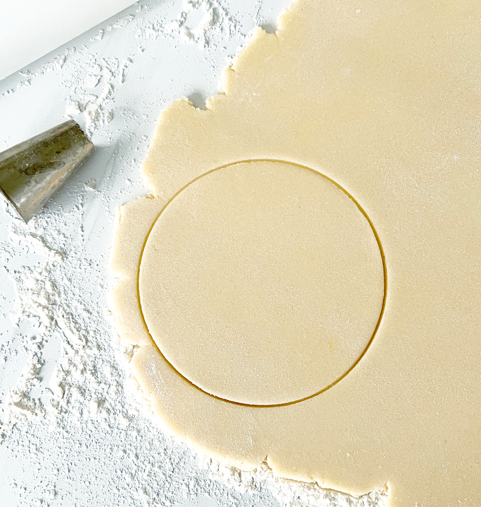 How to Cut Rainbow Sugar Cookies without a Cookie Cutter using large circle cutter on cookie dough