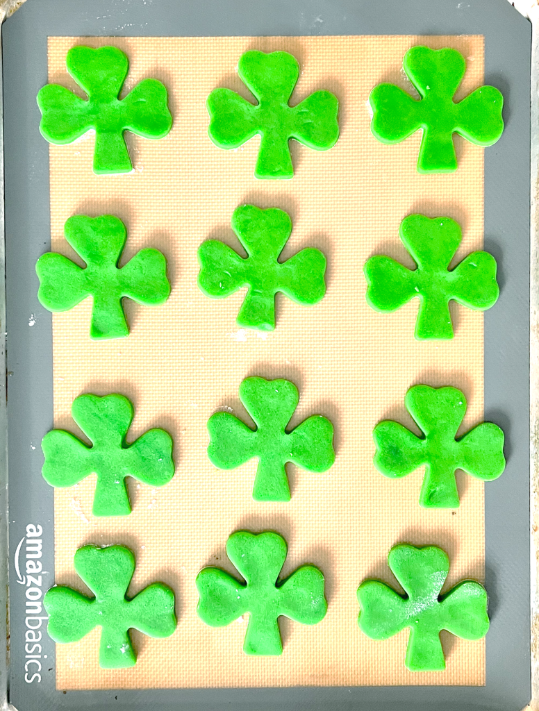 shamrock cut out sugar cookies on cookie sheet with silpat liner from amazon