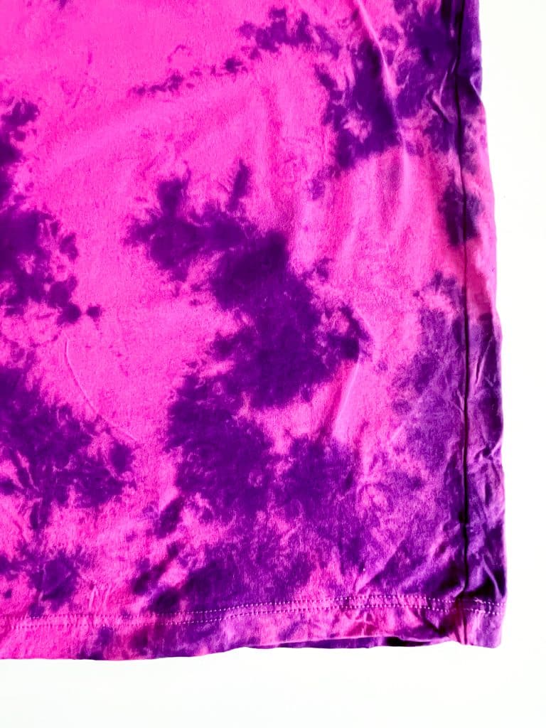 purple tie dye on pink shirt in crumple or scrunch pattern close up