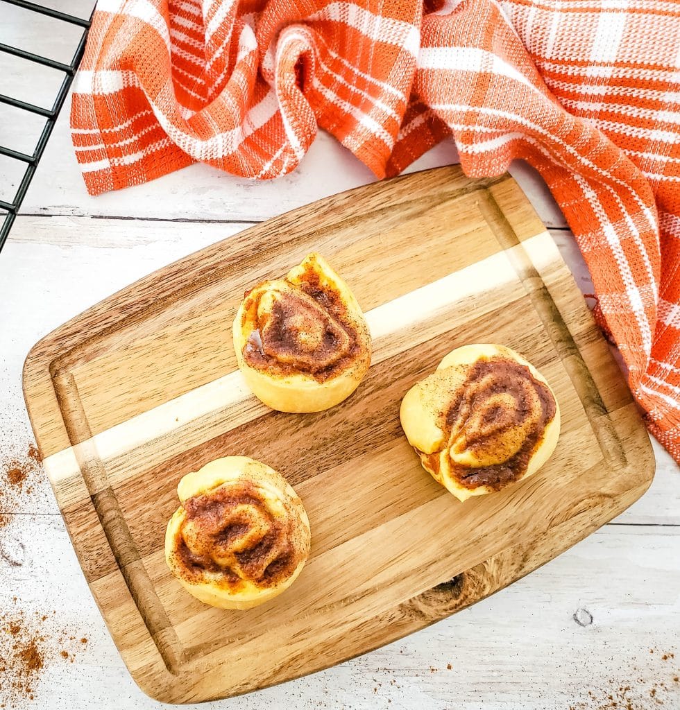 pumpkin pie crescent roll pinwheels on cutting board