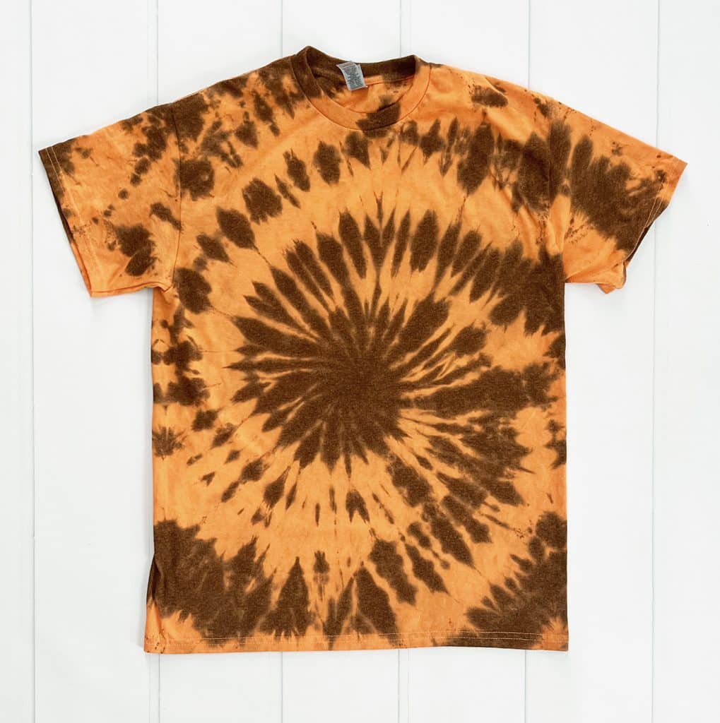 black tie dye spiral on orange shirt