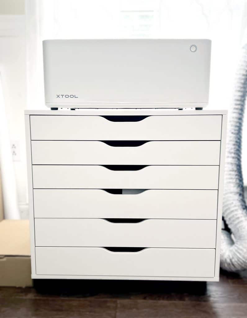 xtool m1 10w machine sitting on ikea storage cart in craft room