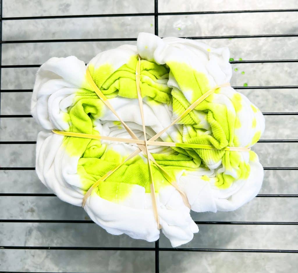 lime green dye on spiral tie dye shirt for grinch tie dye