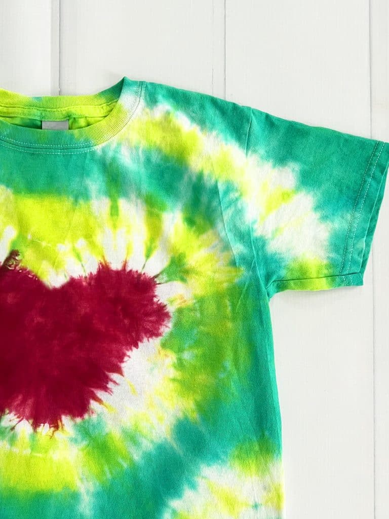 close up of grinch heart tie dye shirt