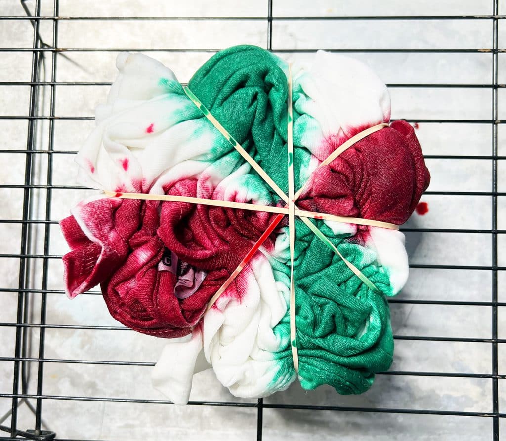 red and green spiral tie dye shirt in process