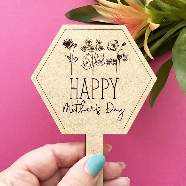 hand holding plant marker for mother's day made with laser cutter