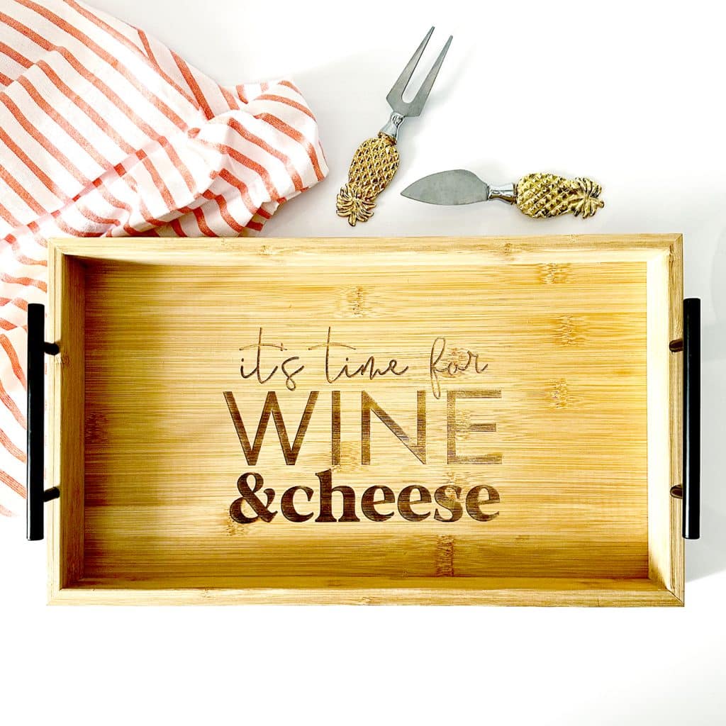 charcuterie board engraved with xtool p2 laser and riser base