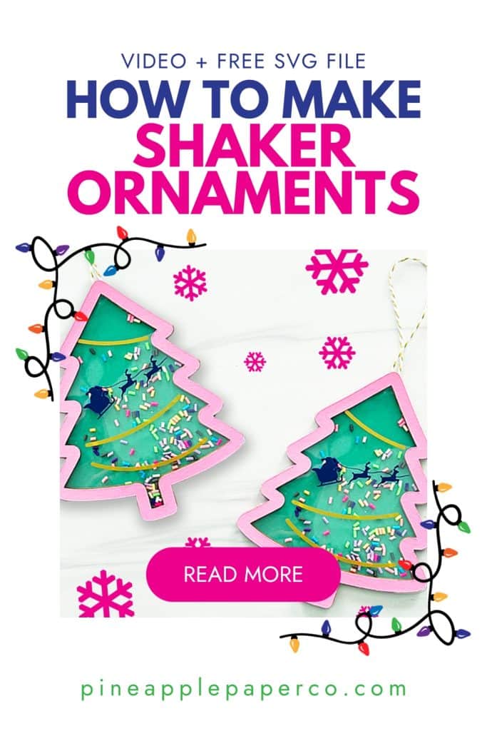 shaker ornaments on marble backgorund wth snowflakes and christmas lights