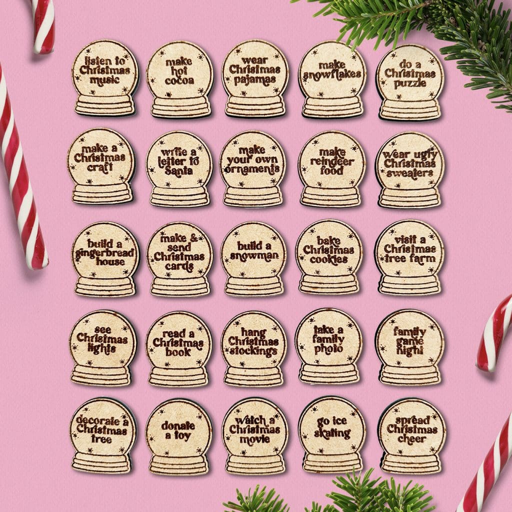 diy christmas activity tokens made with a laser on pink christmas background