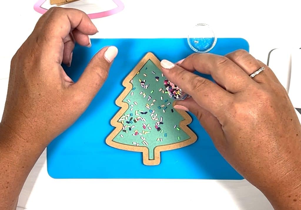adding shaker pieces to diy shaker christmas ornament
