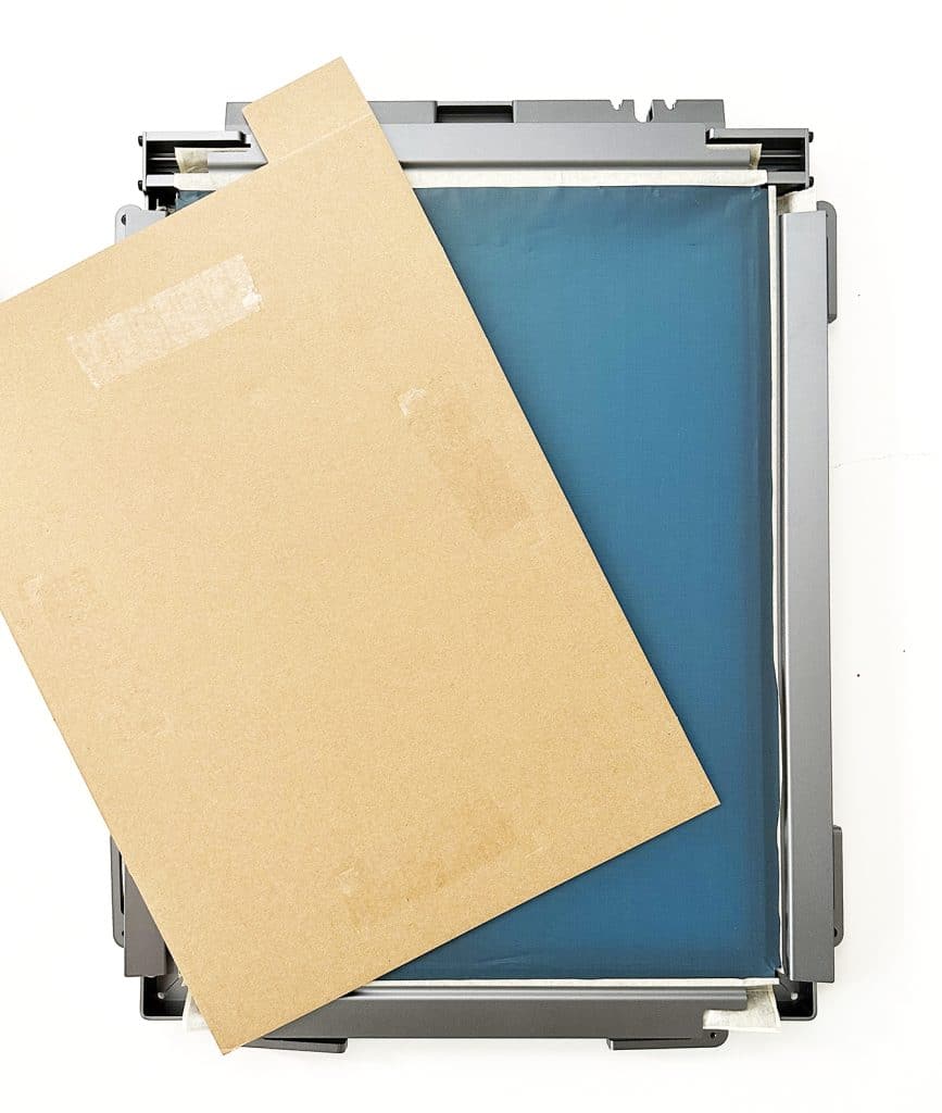 xtool screen printer screen in frame with cardboard