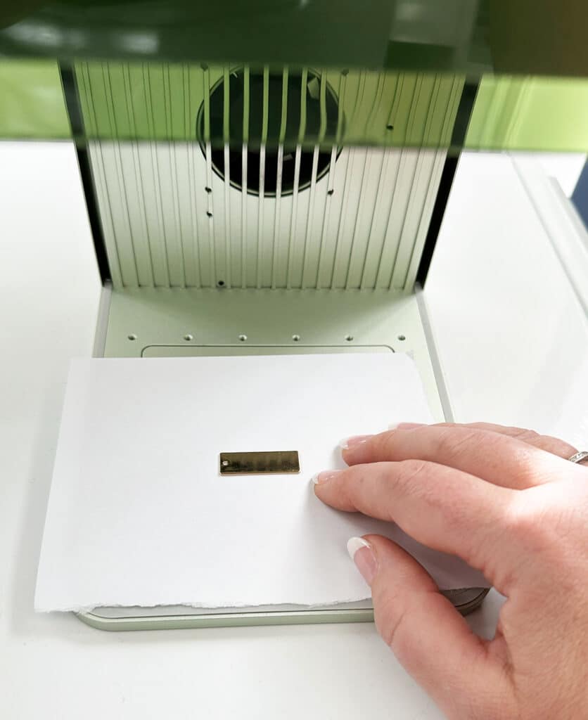 positioning jewelry on base of xTool F1 for engraving