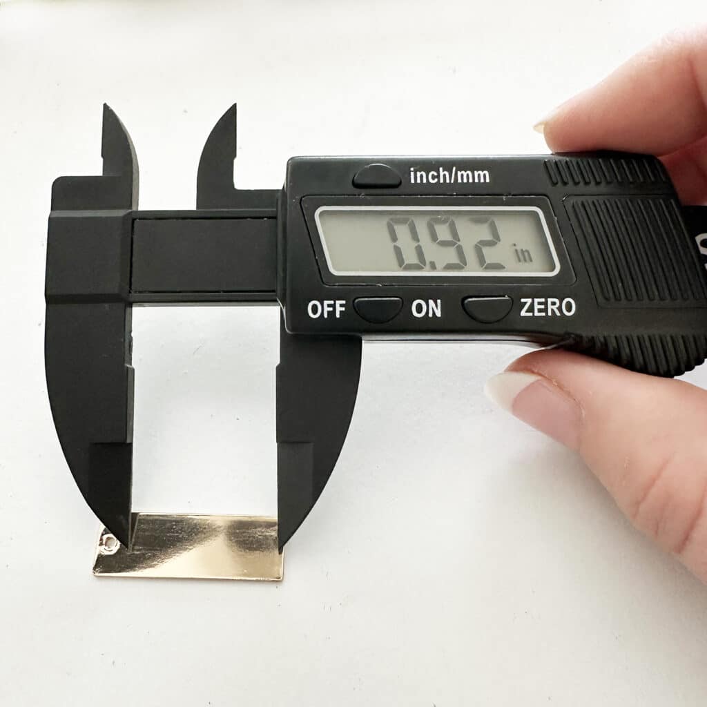 measuring a blank jewelry bar for personalized with digital calipers