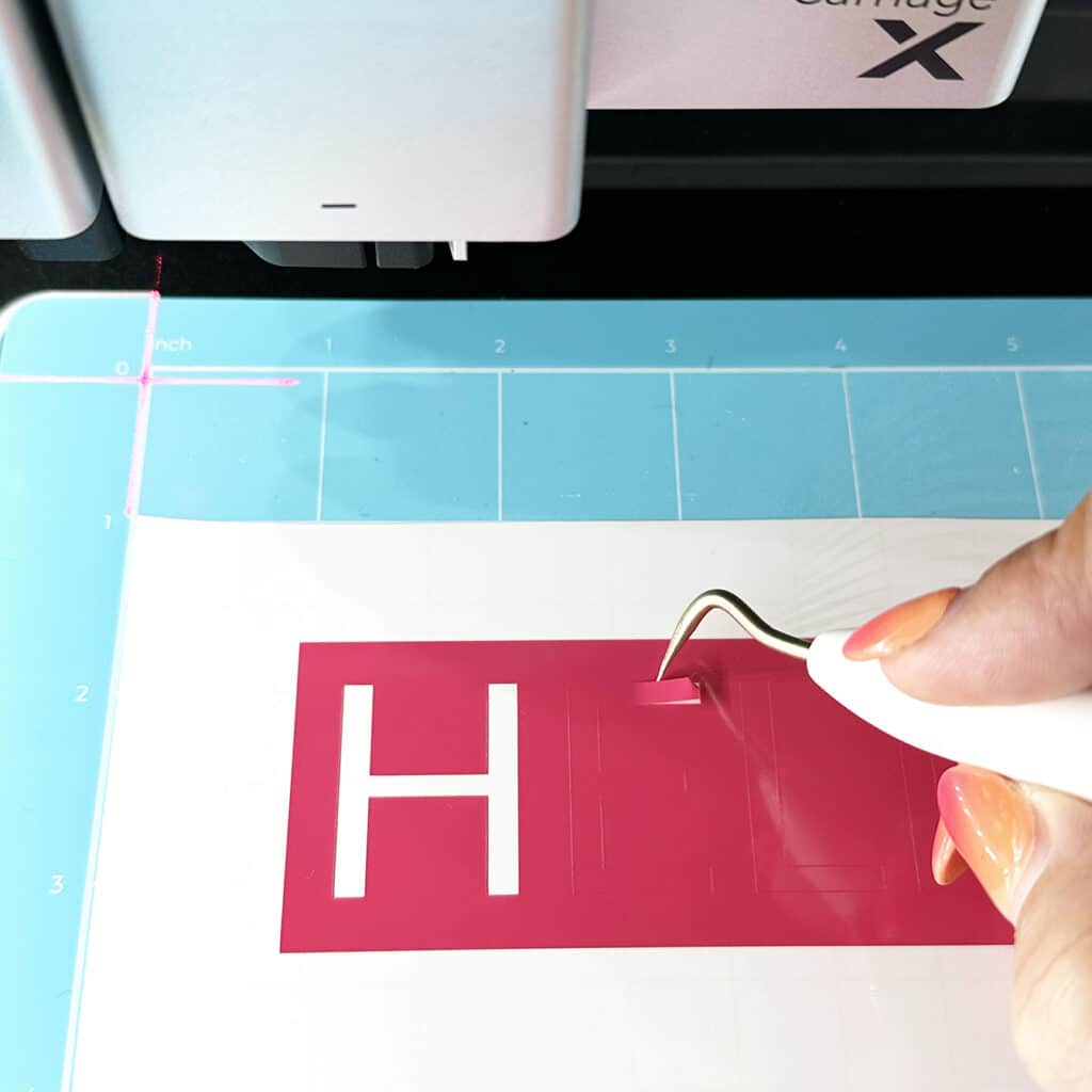 weeding hot pink vinyl with weeding tool in xtool m1 ultra