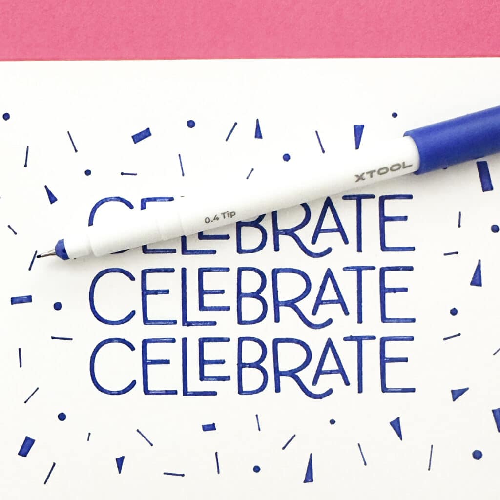 celebrate drawn with blue pen on xtool m1 ultra